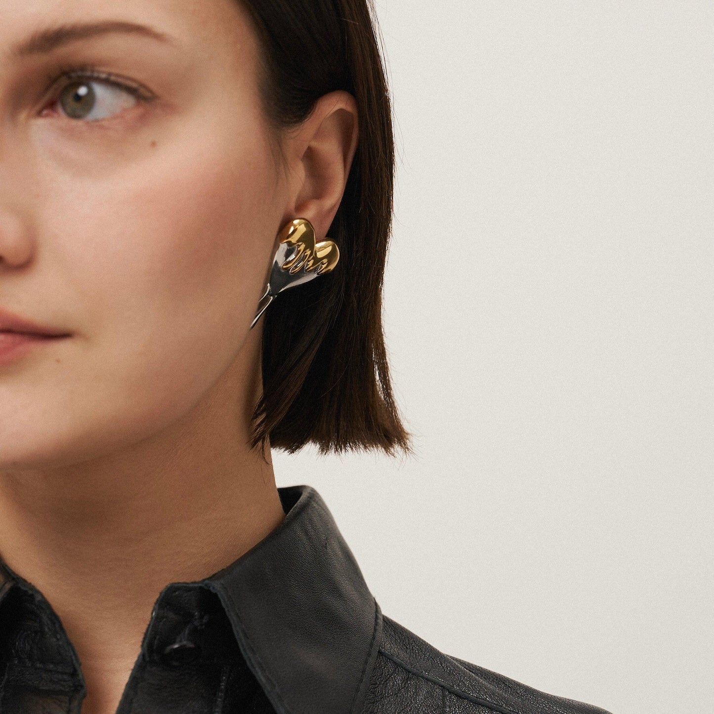 Girl Wearing Gold Plated Heart Stud Earrings. Shop at Mithra and Co.