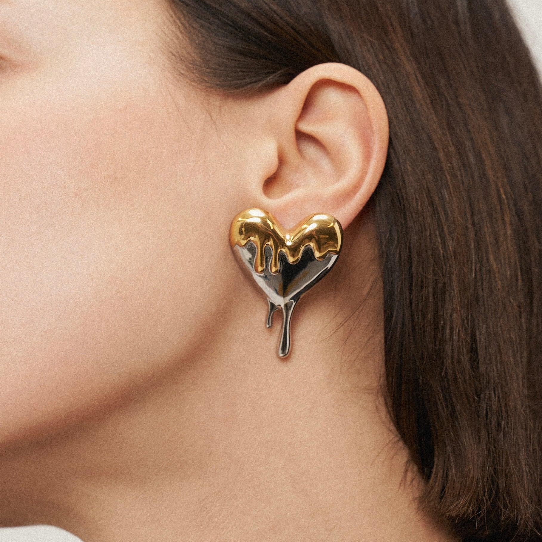 Wearing Gold and silver Plated Melt My Heart Stud Earrings. Buy Online at Mithra and Co.