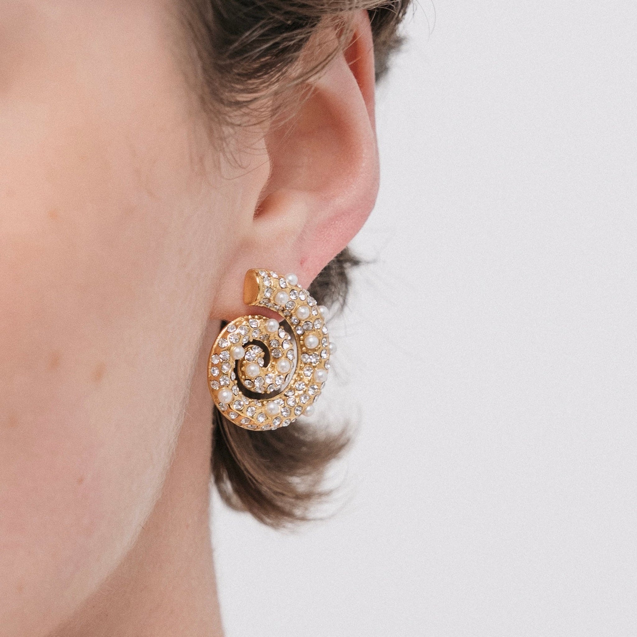 Corum Spiral Earrings — Styled on Model | Pellington UAE