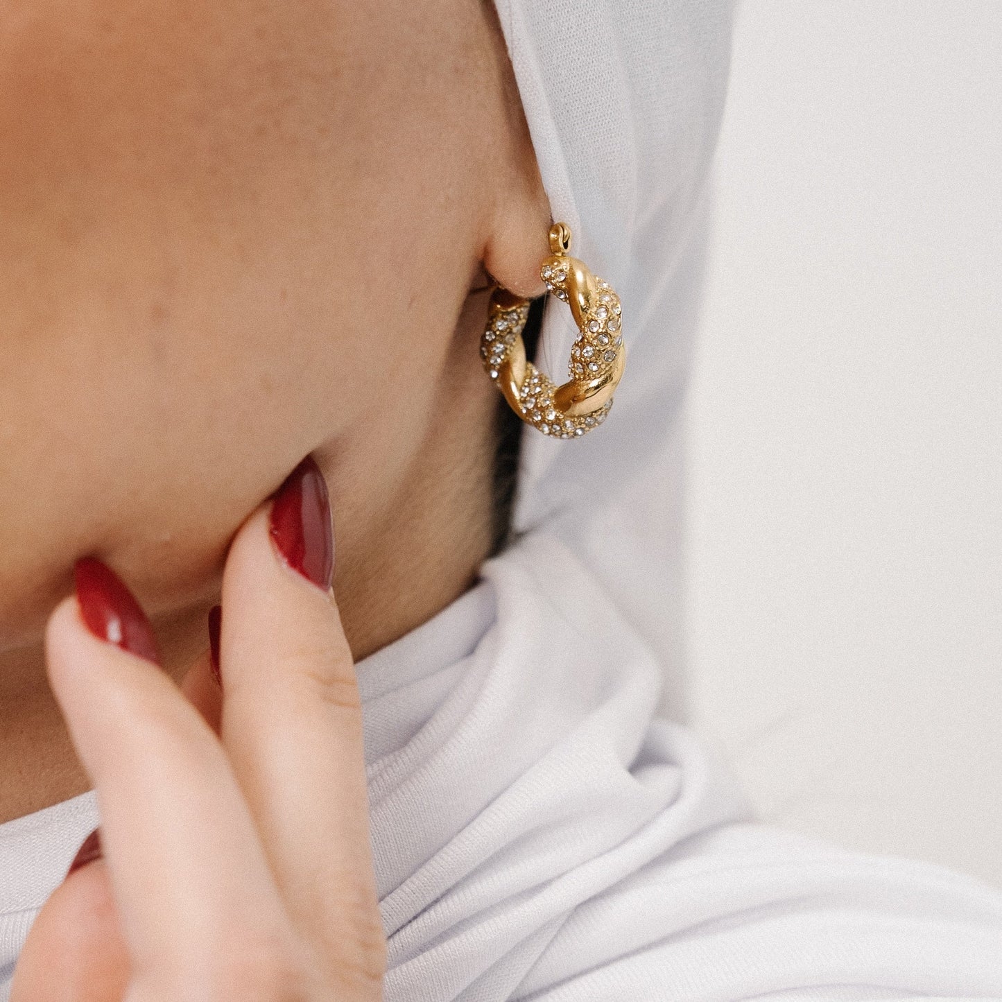 Rimal Twisted Hoop Earrings — Styled on Model | Pellington UAE