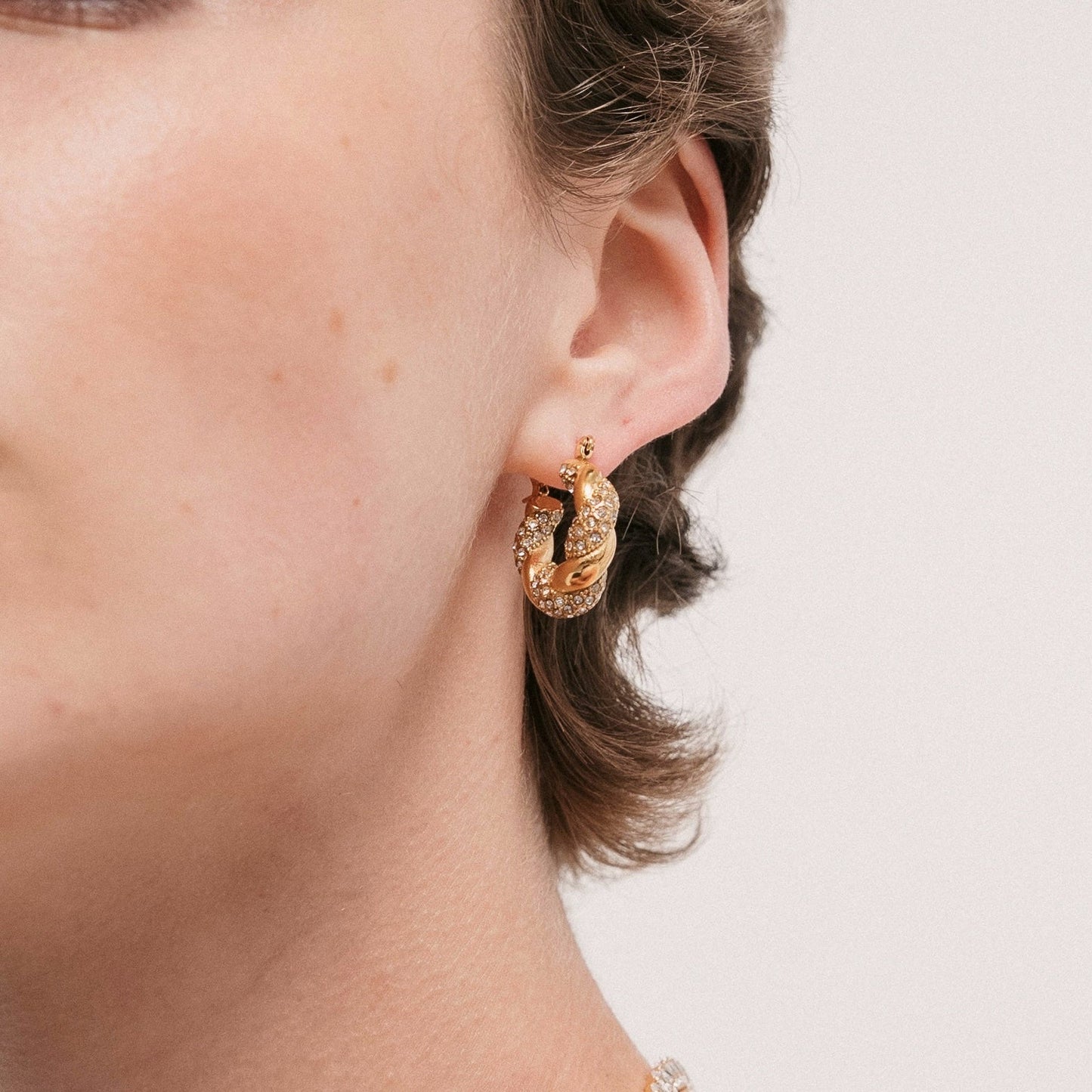 Rimal Twisted Hoop Earrings — On Model | Pellington UAE